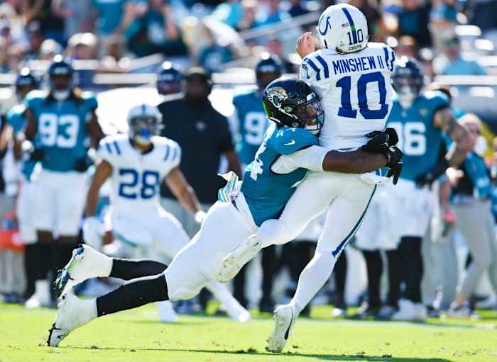 Jacksonville Jaguars linebacker Travon Walker (44) makes a hit on Indianapolis Colts quarterback Gardner Minshew (10) as he attempts a late fourth quarter pass. The Jacksonville Jaguars hosted the Indianapolis Colts at EverBank Stadium in Jacksonville, FL Sunday, October 15, 2023. The Jaguars ended the first half with a 21 to 6 lead and won with a final score of 37 to 20. [Bob Self/Florida Times-Union]